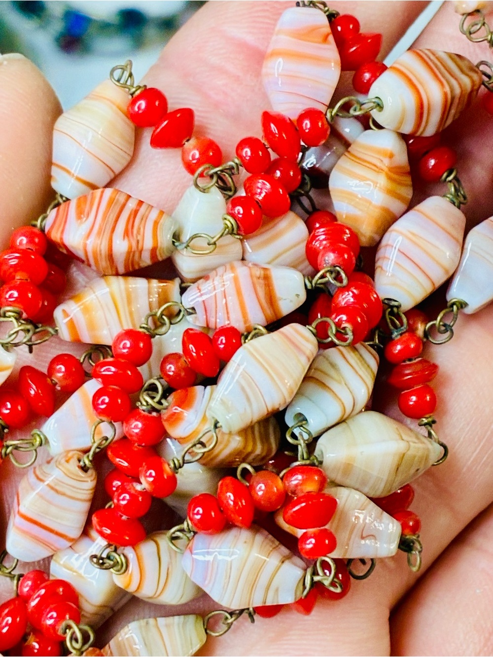 Handcrafted Long Swirl Glass Beaded Necklace – Red & Coral Toned Over The Head